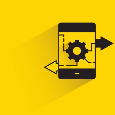 Akıllı telefon üzerindeki işletim sistemi için mobil ve teçhizat sarı arkaplan üzerine damla gölge