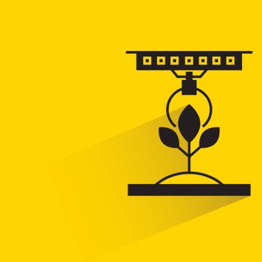 Sarı arka planda akıllı tarım konsepti için robotik kol seçimi bitkisi