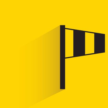 windsock indicator with shadow on yellow background