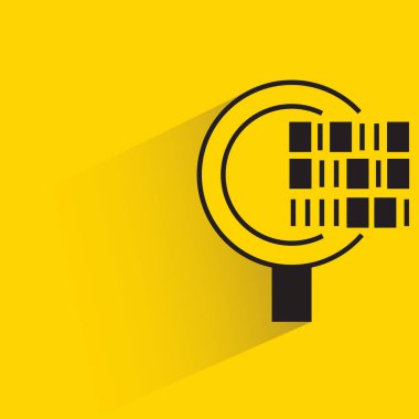 magnifier and bar code with shadow on yellow background