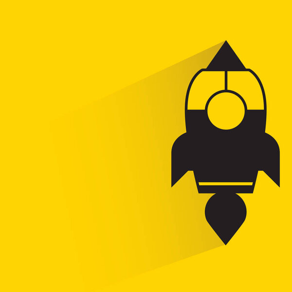 rocket with shadow on yellow background
