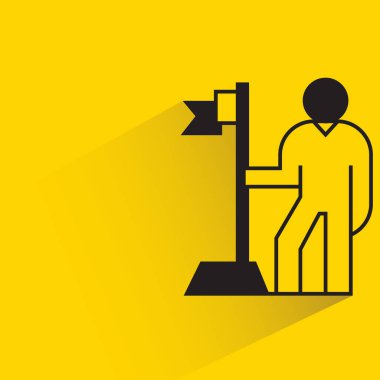 people with flag pole on yellow background