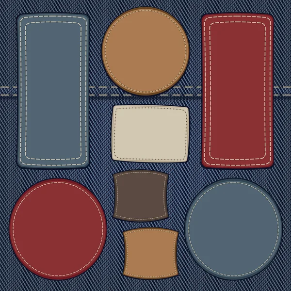 Set lederen etiketten op denim — Stockvector