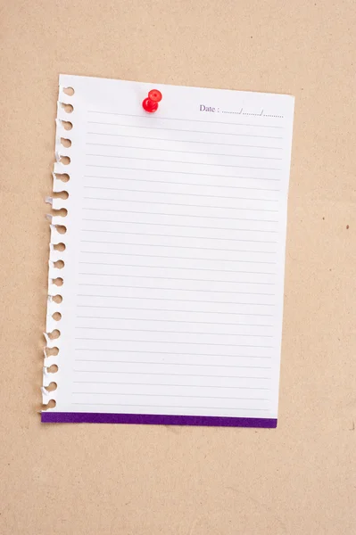 Paper posted on a board with red tack pin. — Stock Photo, Image