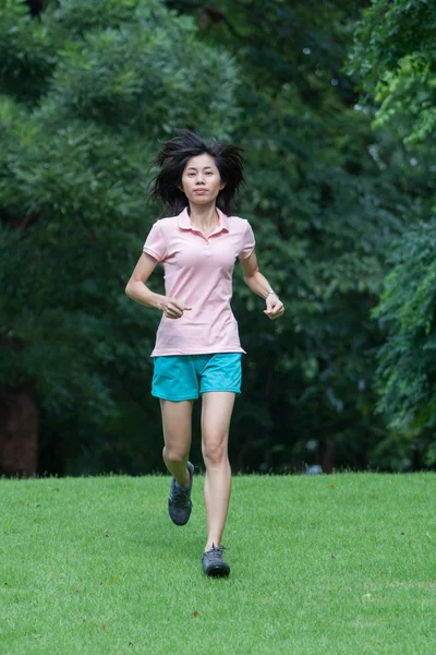 Sport fitness woman running in park — Stock Photo, Image