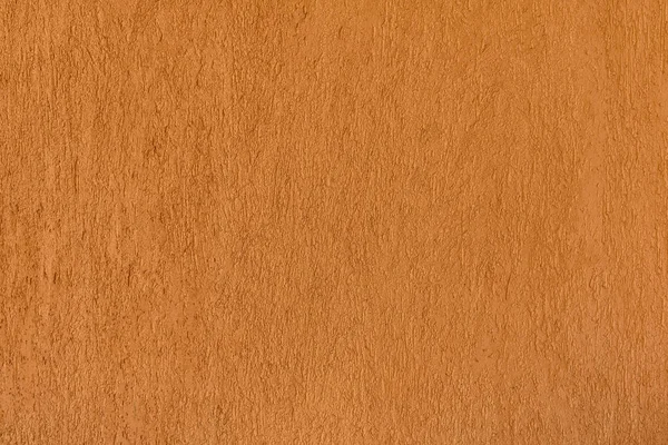 Декоративно-штукатурный фон. Оранжевая гранж-текстура на стене — стоковое фото