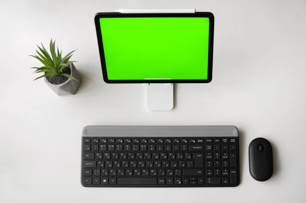 Home office workplace with the tablet device on stand. Minimalism style top view — Φωτογραφία Αρχείου