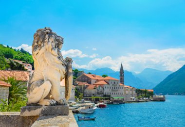 Ancient lion statue in Perast town clipart