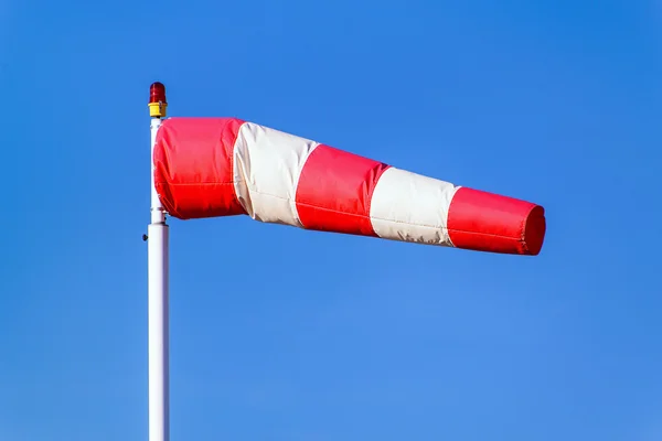 Airport windsock on blue sky