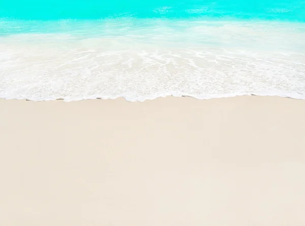 Ocean wave and white sand — Stock Photo, Image