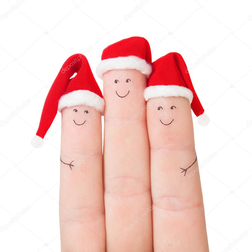 Fingers faces in Santa hats