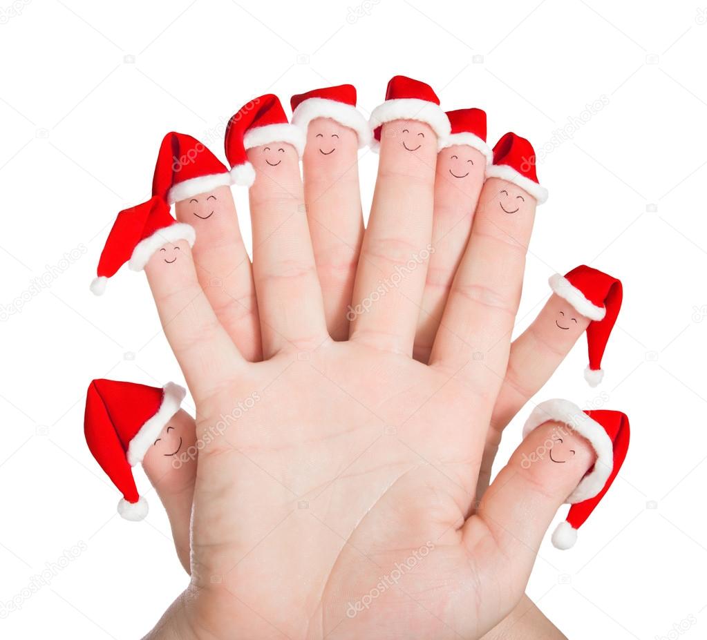 Fingers faces in Santa hats