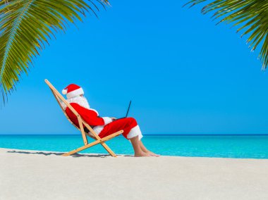 Noel Baba dizüstü kullanarak Beach