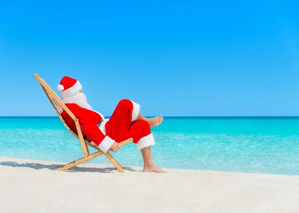 Christmas Santa Claus at beach — Stock Photo, Image