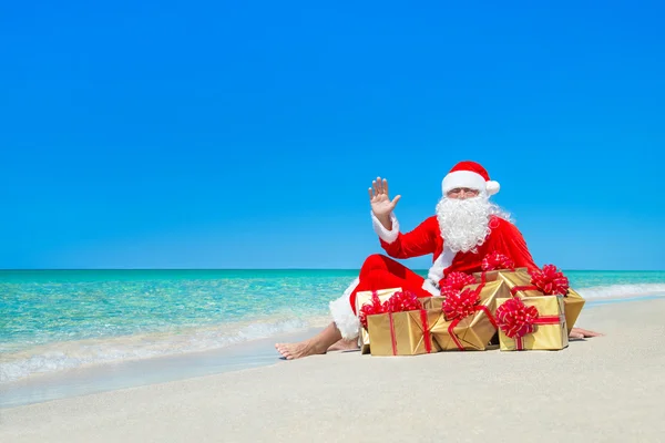 Santa Claus with Christmas gift boxes — Stock Photo, Image