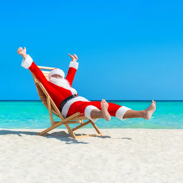 Karácsonyi Santa Claus: beach — Stock Fotó