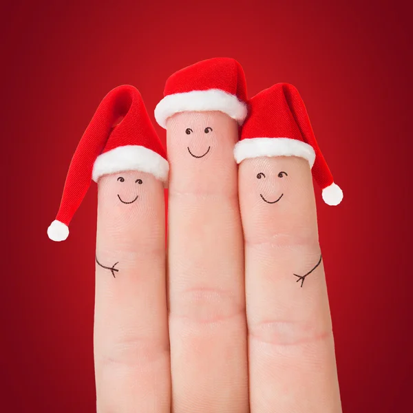 Finger mit Weihnachtsmützen — Stockfoto