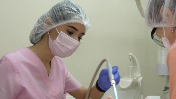 Closeup Beautiful Young Woman Dentist Assistant Helps Physician — Stock Video