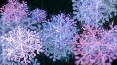 Dönen çok renkli kar taneleri. Işıl ışıl, renkli, parlak tatil kar taneleri. Döngü videosu