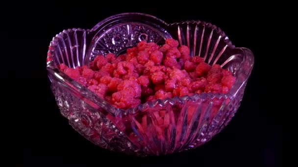 Dark Background Crystal Bowl Fresh Ripe Raspberries Spinning Video — Stock Video