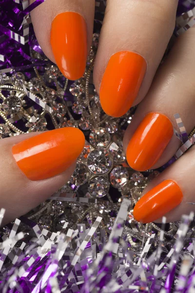 Pomarańczowe paznokcie na tekstura tło — Zdjęcie stockowe