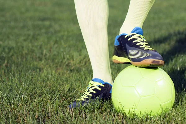 Football legs with ball Royalty Free Stock Photos