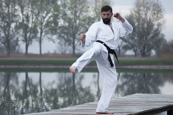 Bearded Man White Kimono Practicing Karate Martial Arts Outdoors Lakeshore — Stock Photo, Image