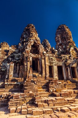 Statue Bayon Temple Angkor Thom, Cambodia. Ancient Khmer architecture clipart