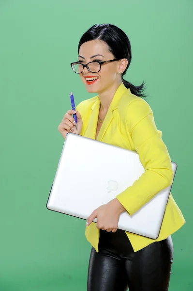 Businesswoman phoning and working with laptop isolated on chroma green background — Stock Photo, Image