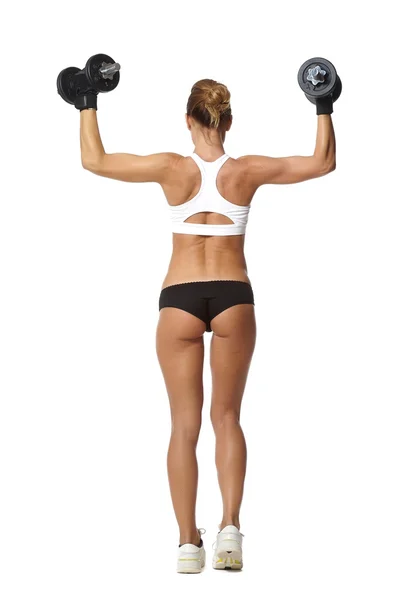 Torso de una joven mujer en forma levantando pesas sobre fondo blanco —  Fotos de Stock