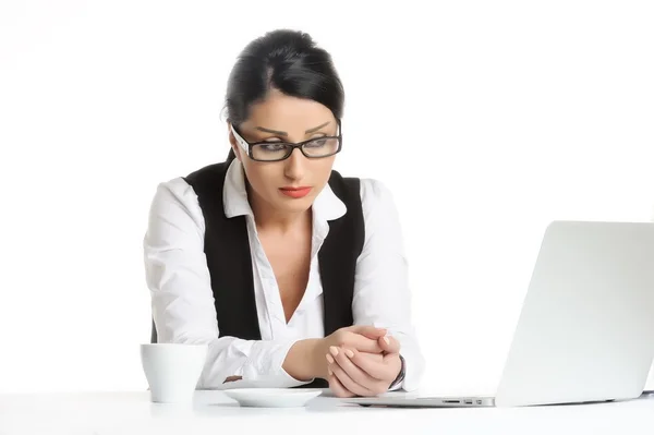 Bored young businesswoman has problems while using laptop.isolated on white — Stock Photo, Image