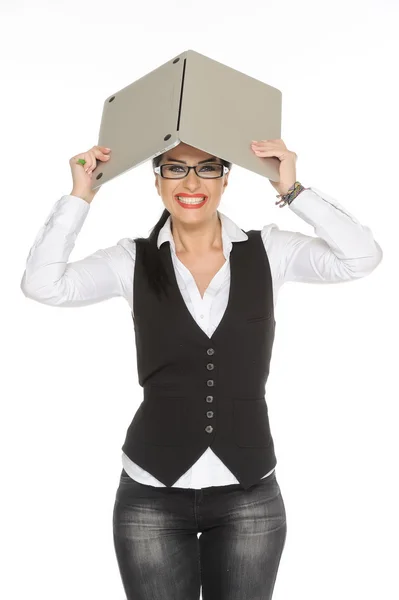 A scared female covering his head with an open laptop isolated on white background — Stock Photo, Image