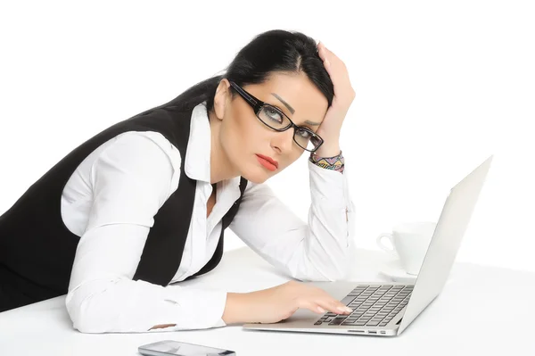 Bored young businesswoman has problems while using laptop.isolated on white — Stock Photo, Image