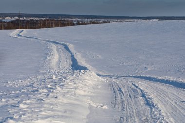 road in a snowy field