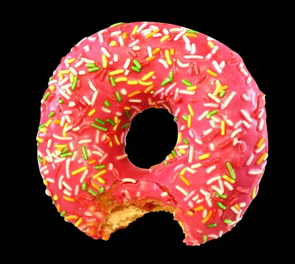 pink donut in the glaze, isolated on black background, tasty fresh watered glaze