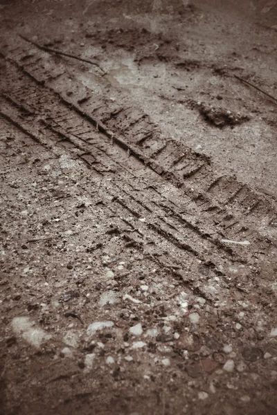 Wheel tracks on the soil — Stock Photo, Image