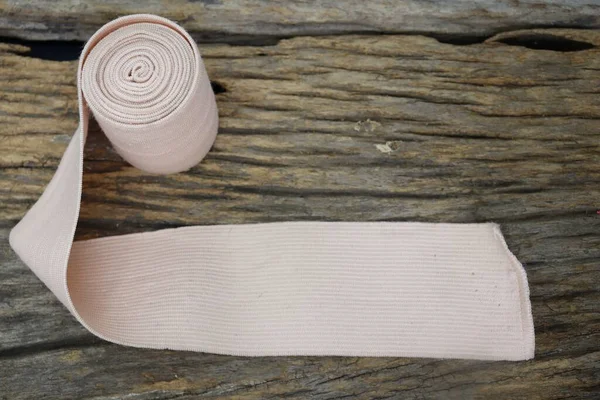 Medical Elastic Bandage Roll Wood Table Background Texture —  Fotos de Stock