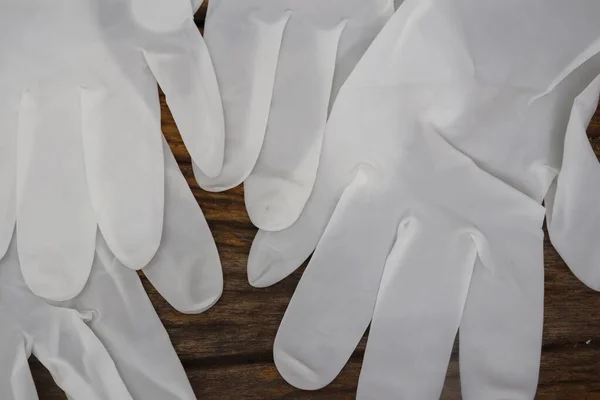 Rubber gloves medical surgical gloves latex glove on wood table background