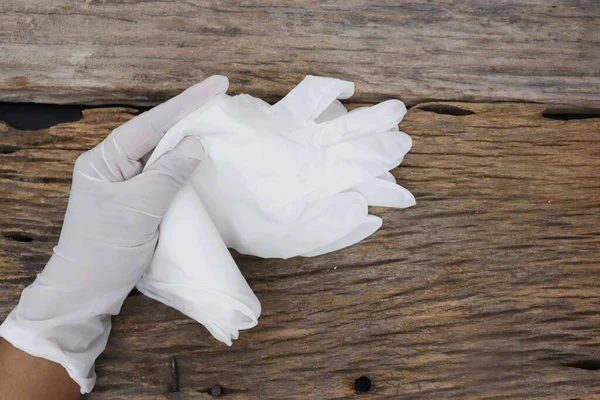 Rubber gloves medical surgical gloves latex glove on wood table background