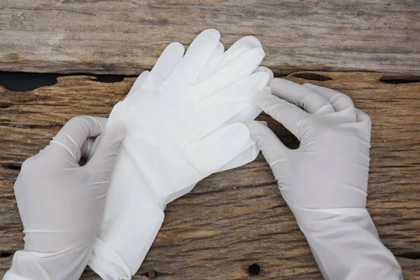 Rubber gloves medical surgical gloves latex glove on wood table background