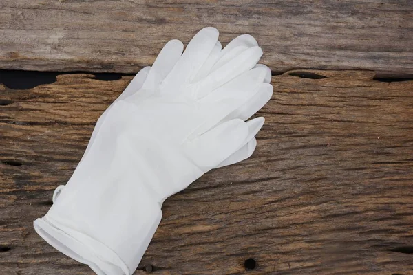 Rubber Gloves Medical Surgical Gloves Latex Glove Wood Table Background — Stok fotoğraf