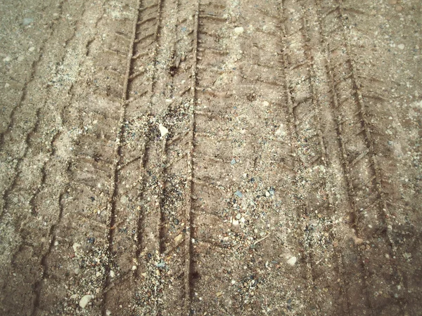 Ślady kół na glebie. — Zdjęcie stockowe