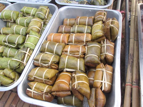 Sticky rice wrapped in banana leaves — Stock Photo, Image