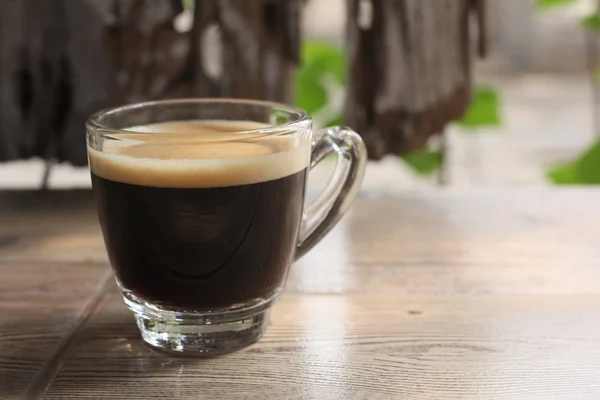 Koffiekopje met vintage achtergrond — Stockfoto