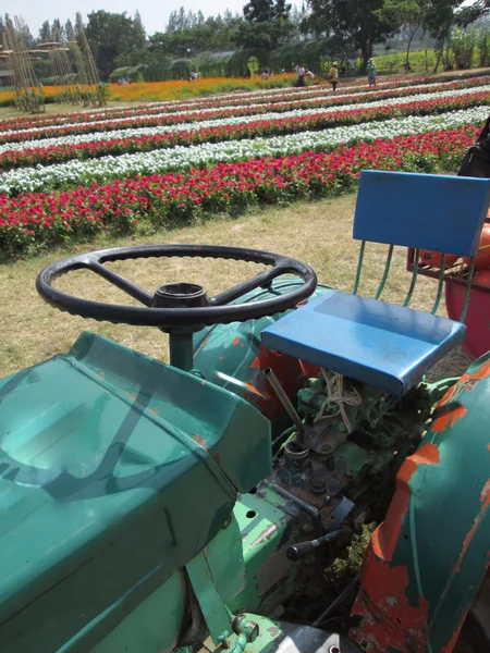 Tractor with colorful flower — Stock Photo, Image