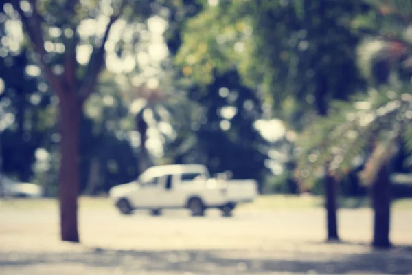 Wazig van auto met bos — Stockfoto