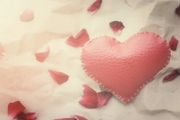 Rose petals with heart — Stock Photo, Image