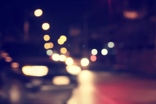 Difuminado de coche en la ciudad por la noche — Foto de Stock