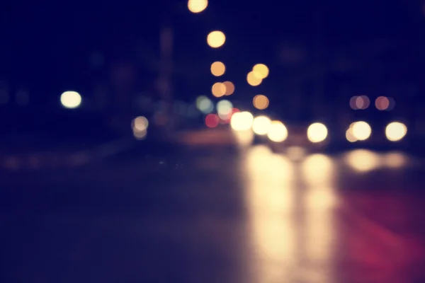 Difuminado de coche en la ciudad por la noche — Foto de Stock