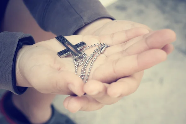 Hands praying with cross — Stock Photo, Image